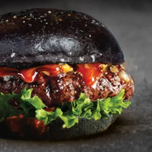 Gourmet Black Pepper Beef handcraft patty burger featuring dark bun, fresh greens from The BRGR menu Malaysia